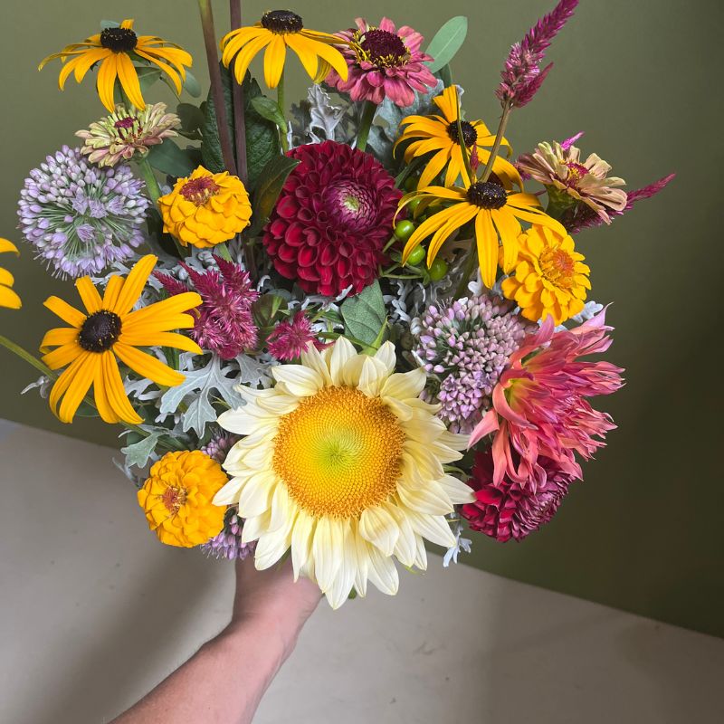 White sunflower and black-eyed Susans in a flower subscription bouquet